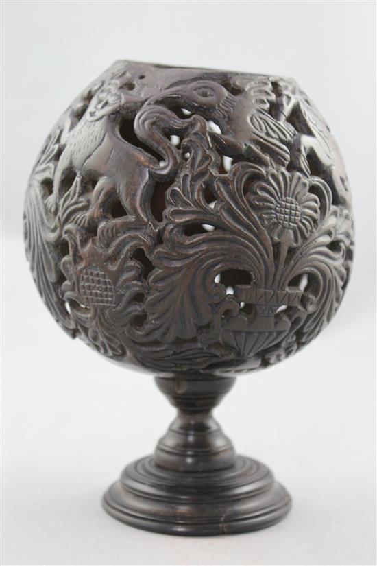 A 19th century carved and pierced coconut cup or goblet, 7.25in.